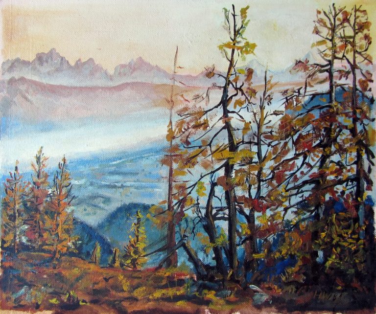 Blick von der Gerlitzen Herbstliche Berglandschaft mit Bäumen und einem weiten Tal im Hintergrund.